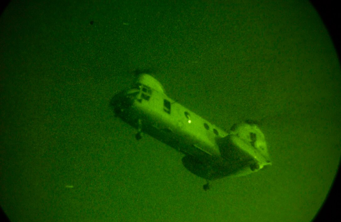 BAGHDAD, Iraq -- (April 2, 2005) - A CH-46E Sea Knight helicopter approaches a landing zone to pick up Charlie Company Marines for a raid. Charlie Co., part of Battalion Landing Team 1/1, conducted patrols in their units area of operation.  The 15th Marine Expeditionary Unit (Special Operations Capable) is currently conducting security and stability operations here in the greater Baghdad area. (Official USA Photo by Sgt. Thomas Benoit)