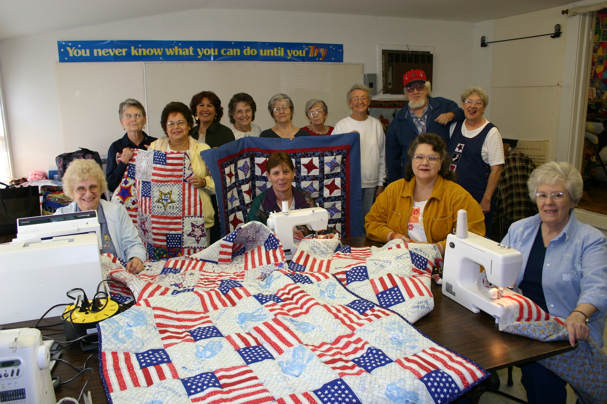 LYTLE, Texas -- The "Lytle Stitchers" display lap quilts made to send to wounded servicemembers fighting the war on terrorism. The group meets weekly in a small quilt shop here.  (U.S. Air Force photo by Master Sgt. Kimberly Spencer)