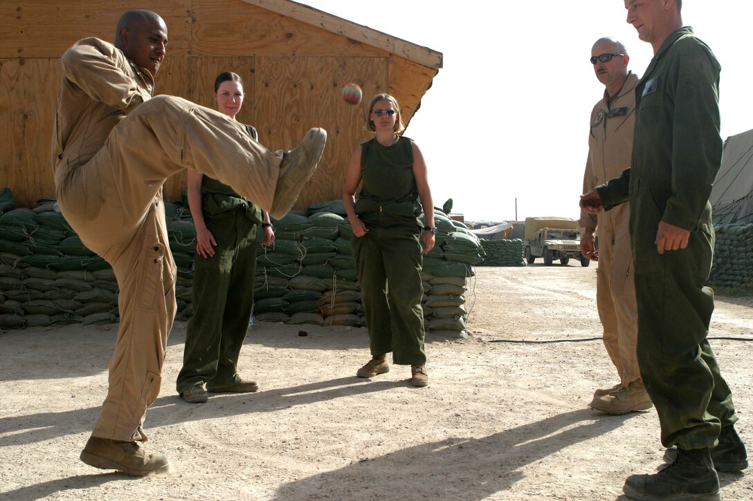 Marines of HMM-165 (REIN), 15th Marine Expeditionary Unit (Special Operations Capable) kill a little time by kicking a foot bag to each other. The 15th MEU (SOC) is wrapping up one month of security and stabilization operations in the Greater Baghdad area.