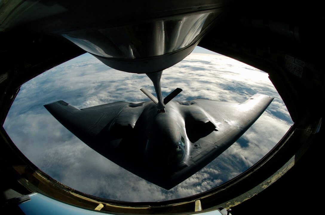 OVER THE PACIFIC OCEAN -- A B-2 Spirit bomber refuels from a KC-135 Stratotanker here during a deployment to Andersen Air Force Base, Guam.  The bomber deployed as part of a rotation that has provided U.S. Pacific Command officials a continuous bomber presence in the Asia-Pacific region, enhancing regional security and the U.S. commitment to the Western Pacific.  The Spirit is from the 509th Bomb Wing at Whiteman AFB, Mo.  The Stratotanker is assigned to the Illinois Air National Guard's 126th Air Refueling Wing at Scott AFB.  (U.S. Air Force photo by Master Sgt. Val Gempis)