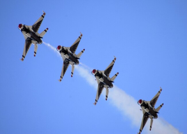 OVER DAVIS-MONTHAN AIR FORCE BASE, Ariz. -- The U.S. Air Force Thunderbirds flight demonstration team fly in trail formation during the 2005 Aerospace and Arizona days here April 2.  The Thunderbirds are assigned to the U.S. Air Force Air Demonstration Squadron at Nellis Air Force Base, Nev.  (U.S. Air Force photo by Airman 1st Class Christina D. Kinsey)
