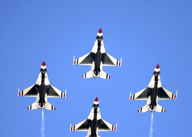 OVER DAVIS-MONTHAN AIR FORCE BASE, Ariz. -- The U.S. Air Force Thunderbirds flight demonstration team fly in diamond formation during the 2005 Aerospace and Arizona days here April 2.  The Thunderbirds are assigned to the U.S. Air Force Air Demonstration Squadron at Nellis Air Force Base, Nev.  (U.S. Air Force photo by Airman 1st Class Christina D. Kinsey)