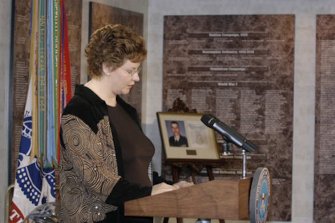 Birgit Smith, wife of Army Sgt. 1st Class Paul Smith, addresses the audience during the Pentagon Hall of Heroes induction ceremony honoring her husband on April 5, 2005. Sgt. Smith was posthumously awarded the Medal of Honor by President George W. Bush in ceremonies at the White House, Apr. 4, 2005. Sgt. Smith, a combat engineer, was killed defending his soldiers on April 4, 2003, in the Battle for the Baghdad Airport. Smith commandeered a .50 caliber machine gun and engaged the enemy force, continuing to fire until the enemy attack was repelled and he was mortally wounded. Smith is the first to receive the military's highest award for actions in support of Operation Iraqi Freedom. The ceremony added Smith's name to the roll of Medal of Honor recipients in the Hall of Heroes. 