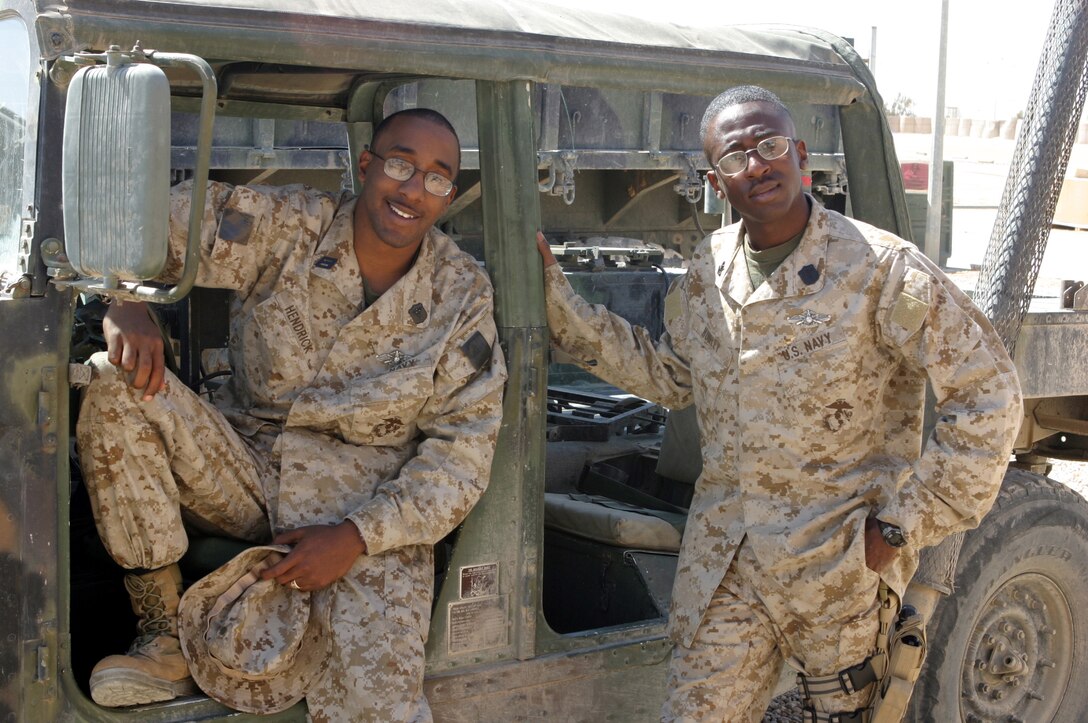 AL ASAD, Iraq –Seaman Albert Hendrick Jr. (left) and Petty Officer 2nd Class Sean Hurley, both with Surgical Company, Combat Logistics Battalion 2, 2d Force Service Support Group (Forward), discovered they are brothers two days before they deployed to Iraq together. (Photo by Cpl. John E. Lawson Jr.)
