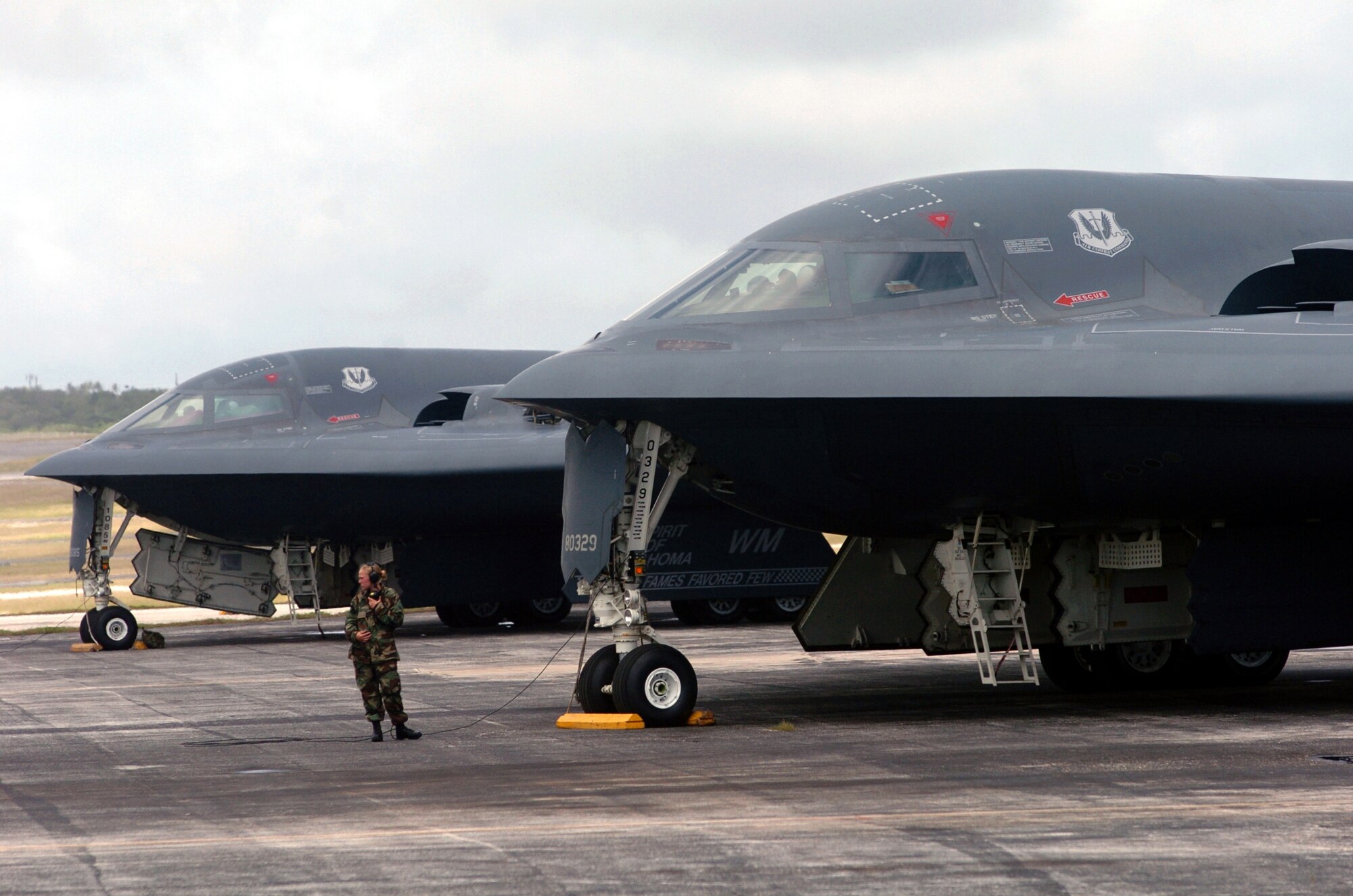 Senior Airman Mindy High prepares to launch a B-2 Spirit bomber during a mission at Andersen Air Force Base, Guam.  The B-2s deployed to Andersen AFB Feb. 25 to provide U.S. Pacific Command officials a continuous bomber presence in the Asia-Pacific region, enhancing regional security and the U.S. commitment to the Western Pacific.  Bomber aircraft have had an ongoing presence on the island since February 2004.  Airman High is a crew chief from the 509th Bomb Wing at Whiteman Air Force Base, Mo.  (U.S. Air Force photo/Master Sgt. Val Gempis)