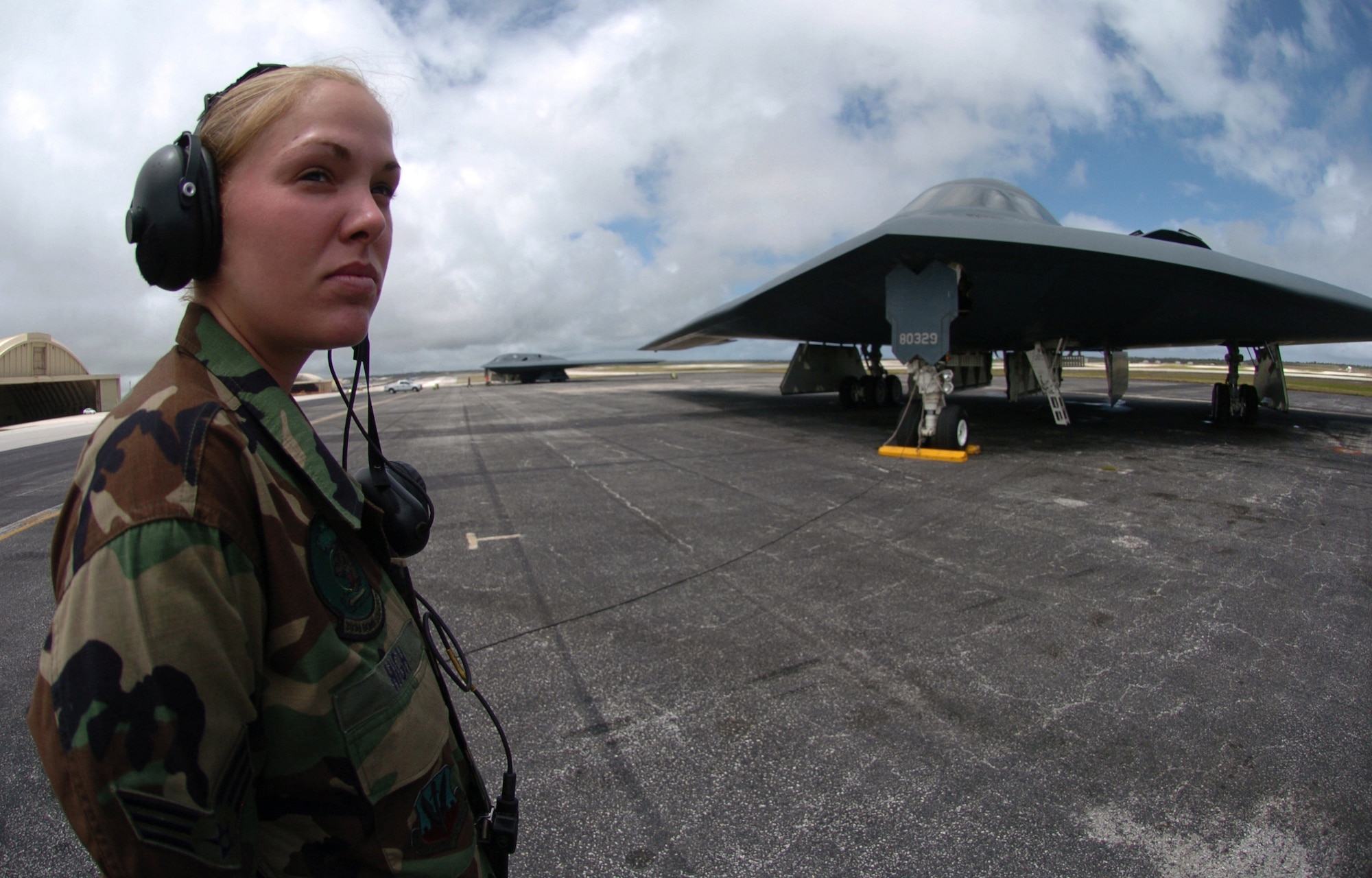 ANDERSEN AIR FORCE BASE, Guam -- Senior Airman Mindy High prepares to launch a B-2 Spirit bomber during a mission here.  The B-2s deployed here Feb. 25 to provide U.S. Pacific Command officials a continuous bomber presence in the Asia-Pacific region, enhancing regional security and the U.S. commitment to the Western Pacific.  Bomber aircraft have had an ongoing presence on the island since February 2004.  Airman High is a crew chief from the 509th Bomb Wing at Whiteman Air Force Base, Mo.  (U.S. Air Force photo by Master Sgt. Val Gempis)