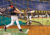 Lance Cpl. Tony Stevens, a former minor-league shortstop with the Minnesota Twins' AA affiliate, the New Britain Rock Cats, participates in batting practice before the Twins' opening day weekend April 10.