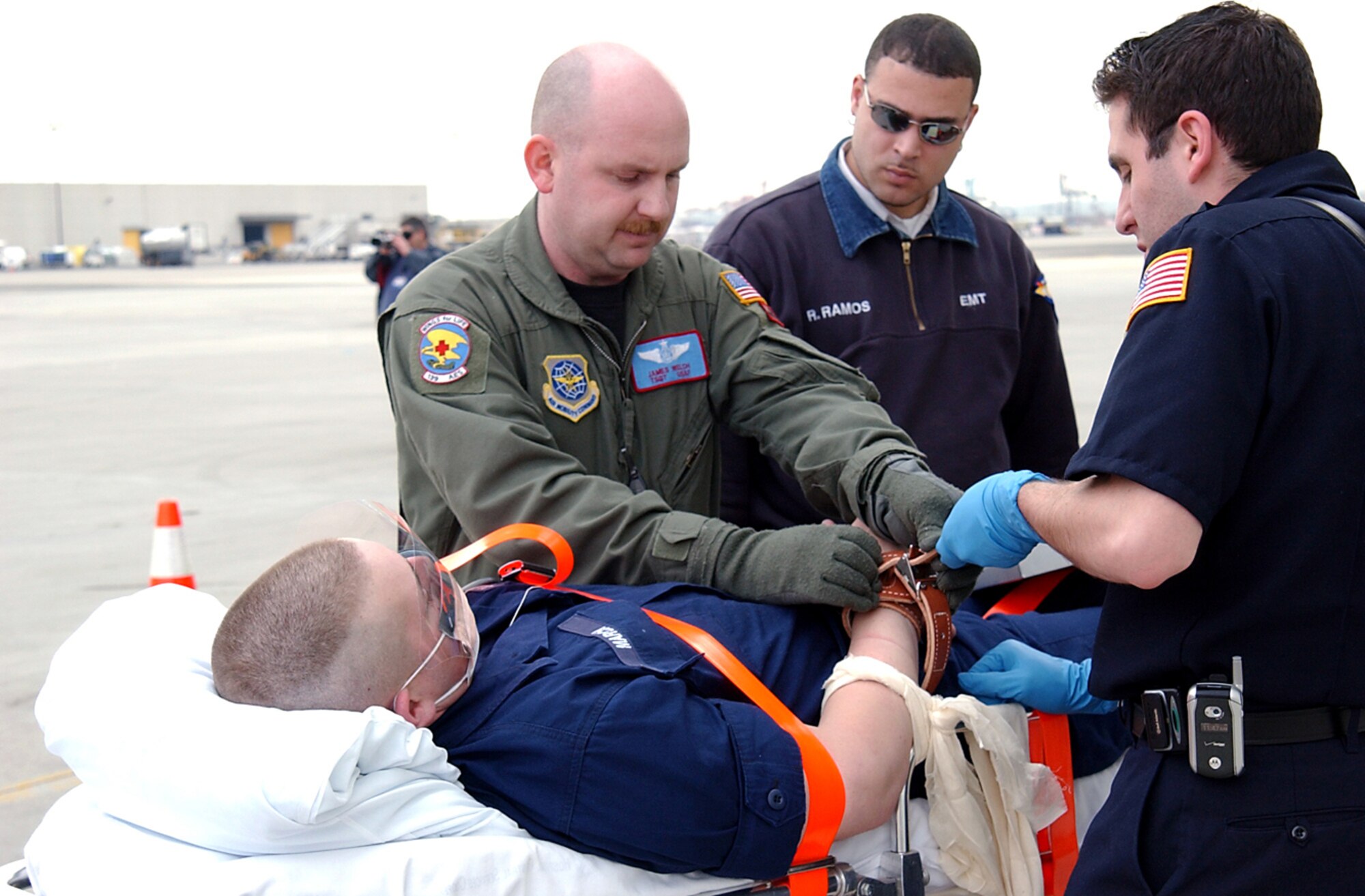 NEWARK AIRPORT, N.J -- An Airman with the 139th Aeromedical Evacuation Squadron evaluates a patient for an LC-130 Hercules flight during the U.S. Department of Homeland Security's Top Officials 3 exercise.  The exercise was one of five full-scale, congressionally directed, weapons of mass destruction exercises taking place throughout Connecticut and New Jersey.  (U.S. Air Force photo by Staff Sgt. Mike R. Smith)
