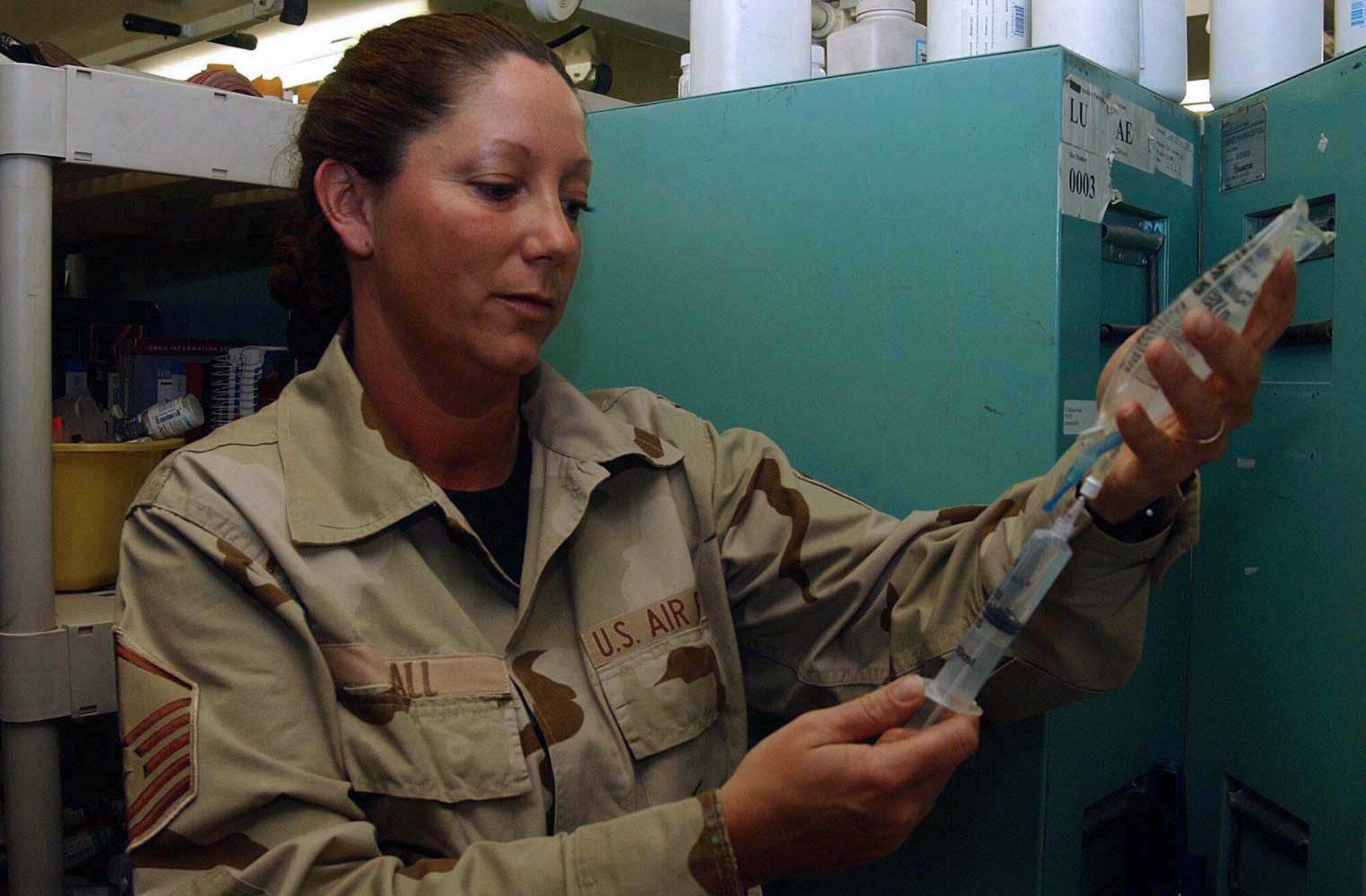BALAD AIR BASE, Iraq -- Master Sgt. Rhonda Ball prepares an IV at the pharmacy here.  She is assigned to the 332nd Expeditionary Medical Support Squadron.  (U.S. Air Force photo by Senior Airman Colleen Wronek)