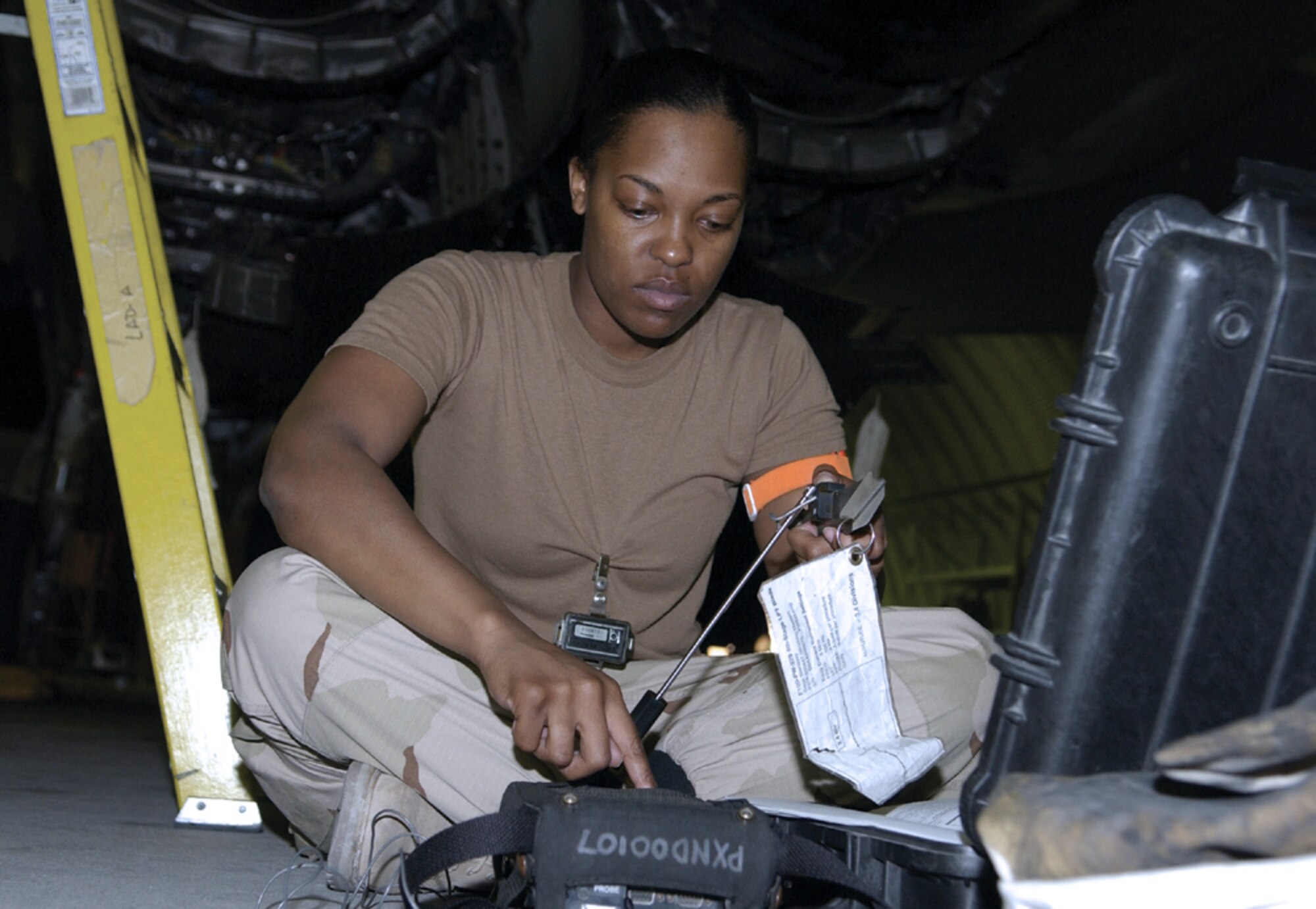 SOUTHWEST ASIA -- Senior Airman Kenda Lewis checks for cracks in an F-15 Eagle engine using an Eddy current tester.  She is assigned to the 379th Expeditionary Maintenance Squadron's nondestructive inspection lab at a forward-deployed location and is from Royal Air Force Lakenheath, England.  (U.S. Air Force photo by Senior Master Sgt. John Snow)