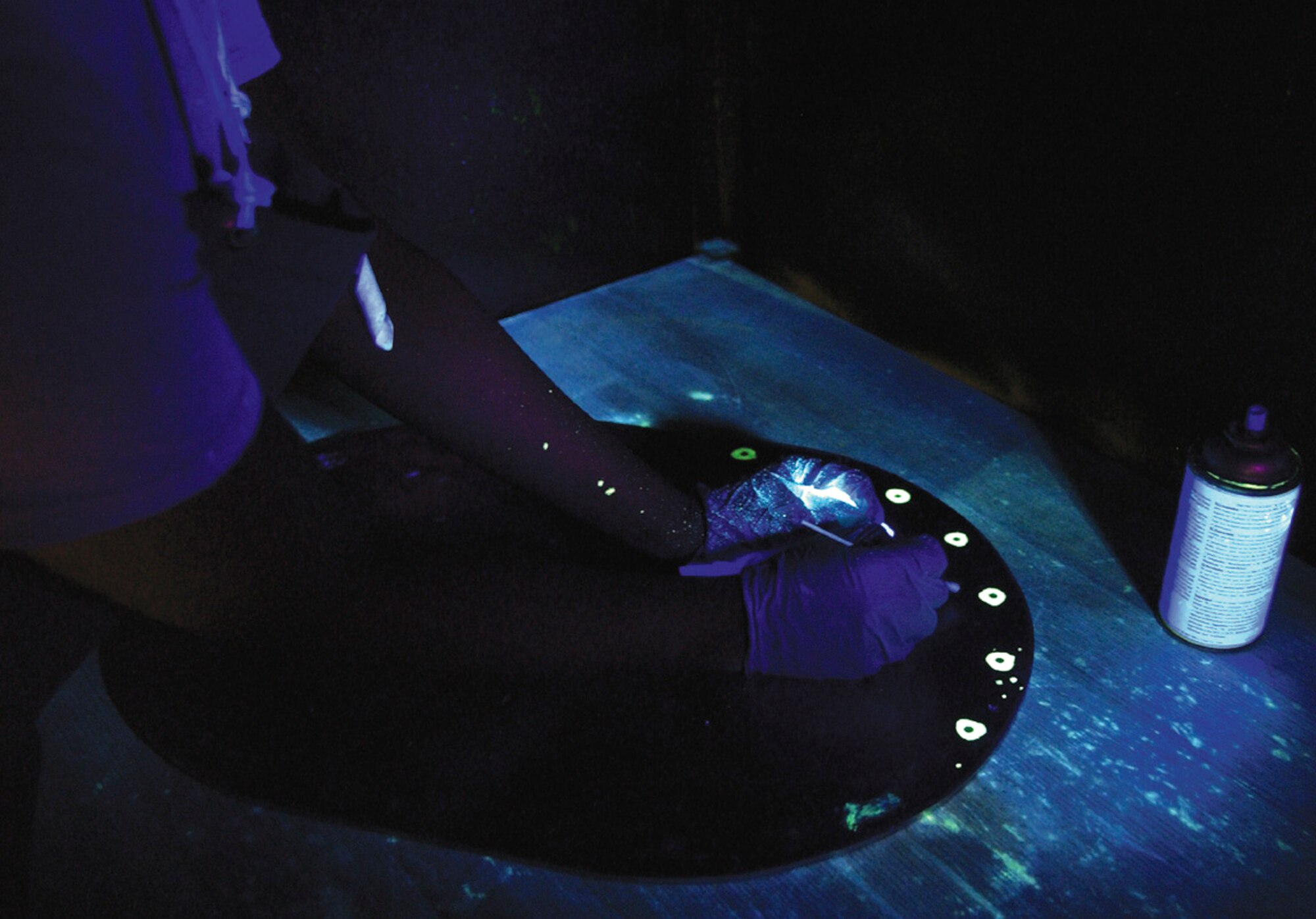 SOUTHWEST ASIA - Nondestructive inspection specialists use fluorescent paint and black lights in a darkroom lab to inspect aircraft parts at a forward-deployed location.  (U.S. Air Force photo by Senior Master Sgt. John Snow)