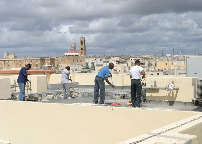 The Marines and Sailors of the USS Ashland volunteer their time during community service projects during a liberty port in Sliema, Malta.  Chaplain Jones B. Ofuasia, the chaplain for Battalion Landing Team, 2nd Bn., 8th Marines, 26th Marine Expeditionary Unit (Special Operations Capable) and Hospital Corpsman Troy A. Deagrella also with BLT 2/8, sweep the roof April 12th of the St. Paul's Home care facility run by the Little Sisters of the Poor in Hamrun, Malta.  The Marines and Sailors from the ship landing dock USS Ashland (LSD 48) and the 26th MEU (SOC) volunteered their time to help with needed repair and cleanup of the building during what will likely be their only liberty port for some time on their current deployment in support of the Global War on Terrorism. St. Paul's Home provides living accommodations for elderly citizens of Malta who do not have the means to care for themselves. (Official photo by Sgt. Mario Gonzalez) (Released)