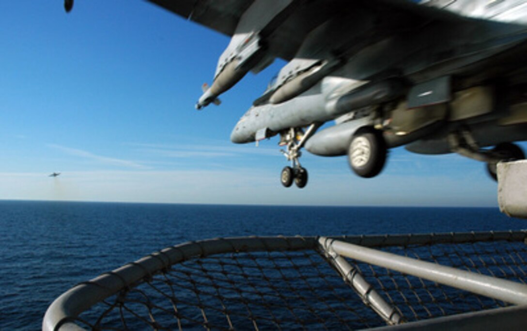 A Navy F/A-18C Hornet clears the bow as it catapults from the flight deck of the USS Carl Vinson (CVN 70) on April 9, 2005. The Carl Vinson Carrier Strike Group is conducting operations in support of multi-national forces in Iraq and maritime security operations in the Persian Gulf. The Hornet is assigned to Strike Fighter Squadron 147 deployed from Naval Air Station Lemoore, Calif. 