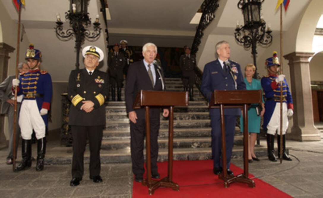 Chairman of the Joint Chiefs of Staff Gen. Richard Myers (right), U.S. Air Force, uses an interpreter to answer questions from Ecuadorian and U.S. media during a press conference with Ecuadorian Chairman of Defense Adm. Victor Rosero (left) in Quito, Ecuador, on April 11, 2005. Myers is in Ecuador to meet with the military and civilian leadership to further military-to- military relations. 