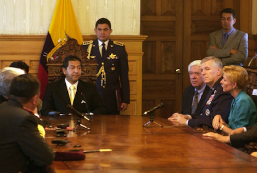 Chairman of the Joint Chiefs of Staff Gen. Richard Myers (2nd from right), U.S. Air Force, meets with Ecuadorian President Lucio Guitierrez (left) at the Presidential Palace in Quito, Ecuador, on April 11, 2005. Myers is in Ecuador to meet with the military and civilian leadership to further military-to-military relations. 