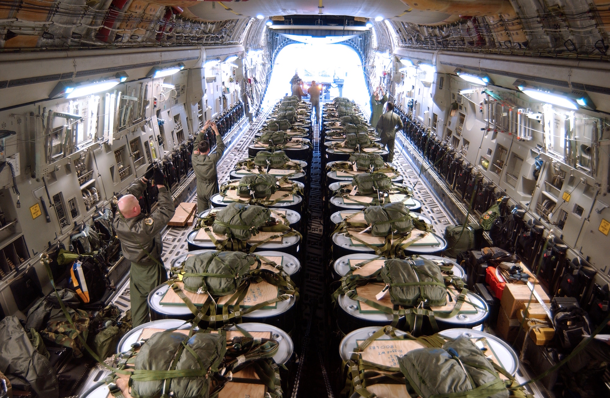 MCCHORD AIR FORCE BASE, Wash. -- Airmen here load pallets of fuel onto a C-17 Globemaster III to support the C-17 Globemaster III's first polar airdrop.  About 10,000 gallons of fuel were dropped to help National Science Foundation scientists near the North Pole.  (U.S. Air Force photo by Kevin J. Tosh Jr.)