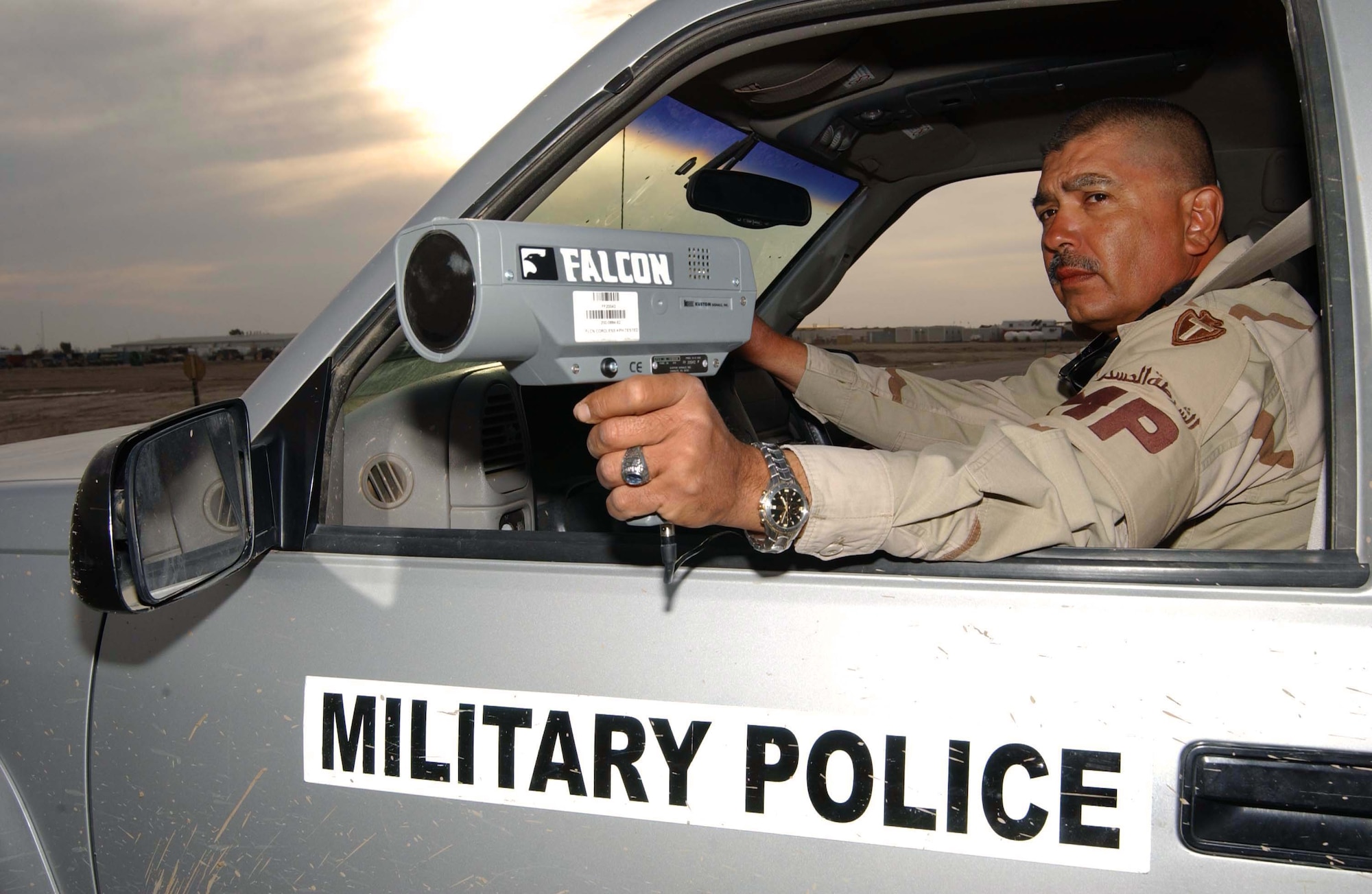 TALLIL AIR BASE, Iraq -- Army Sgt. Jessie DeLarosa uses a radar gun to catch speeding violators here.  He is a military policeman with the Texas Army National Guard's 36th Infantry Division and is deployed from San Antonio.  (U.S. Army photo by Master Sgt. Lek Mateo)