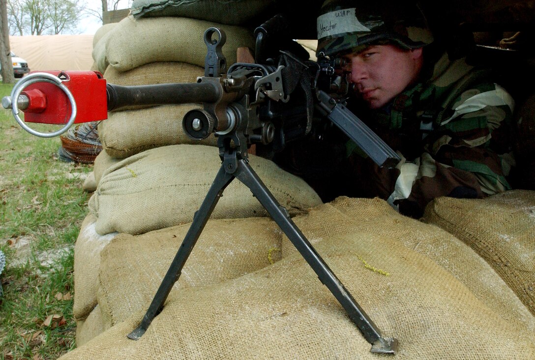 LANGLEY AIR FORCE BASE, Va. -- Airman 1st Class Hector Barreto mans a bunker, armed with an M-249 squad assault weapon during a phase 1 and 2 operation readiness exercise here April 13. Airman Barreto is a security forces Airmen with the 1st Security Forces Squadron. (U.S. Air Force photo by Staff Sgt. Verlin Levi Collins)