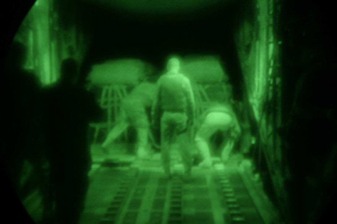 Marines from Marine Aerial Refueler Transport Squadron 252 prepare more than 22,000 pounds of cargo for an air drop April 16.  This was the first successful aerial delivery of cargo since the KC-130J arrived here in February.  This also marked the first combat aerial delivery for the J model aircraft.  The airdrop measured six truck loads worth of supplies, which means more than 12 Marines did not have to risk convoy operations.