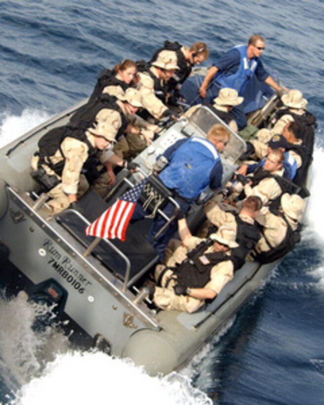 A Maritime Security Operations team pulls away from the guided missile destroyer USS Mustin (DDG 89) on a Rigid Hull Inflatable Boat to conduct a routine boarding of a foreign vessel in the Persian Gulf on April 13, 2005. U.S. and Coalition Forces continuously plan and execute maritime security operations to deny terrorists use of the maritime environment. Mustin is currently deployed as part of the USS Carl Vinson Strike Group. 