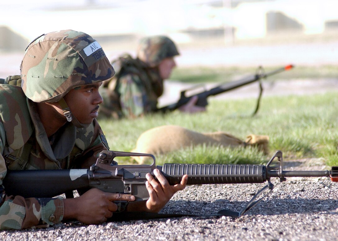 ELLSWORTH AIR FORCE BASE, S.D. -- Airman 1st Class James Temple takes cover during a simulated attack here April 18.  The 28th Civil Engineer Squadron Airmen participate in convoy training to prepare for upcoming deployments.  (U.S. Air Force photo by Staff Sgt. Joanna E. Hensley)