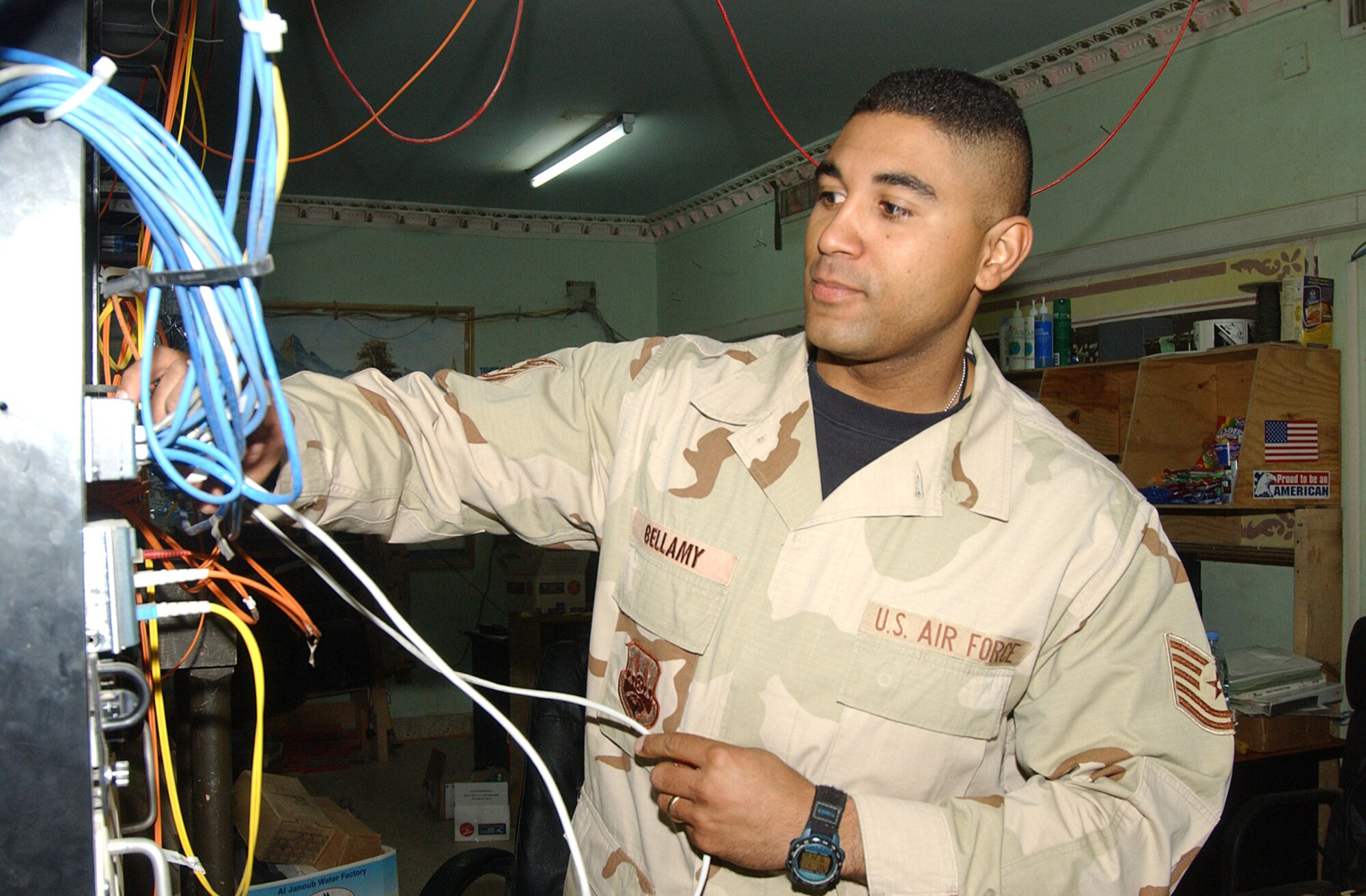 BALAD AIR BASE, Iraq - Tech. Sgt. Will Bellamy patches a computer into a network switch here.  Airmen with the 332nd Expeditionary Communications Squadron work together to provide communication means throughout the base.  Sergeant Bellamy is the noncommissioned officer in charge of network managements with the squadron, and is deployed from Barksdale Air Force Base, La.  (U.S. Air Force photo by Senior Airman Colleen Wronek)                    