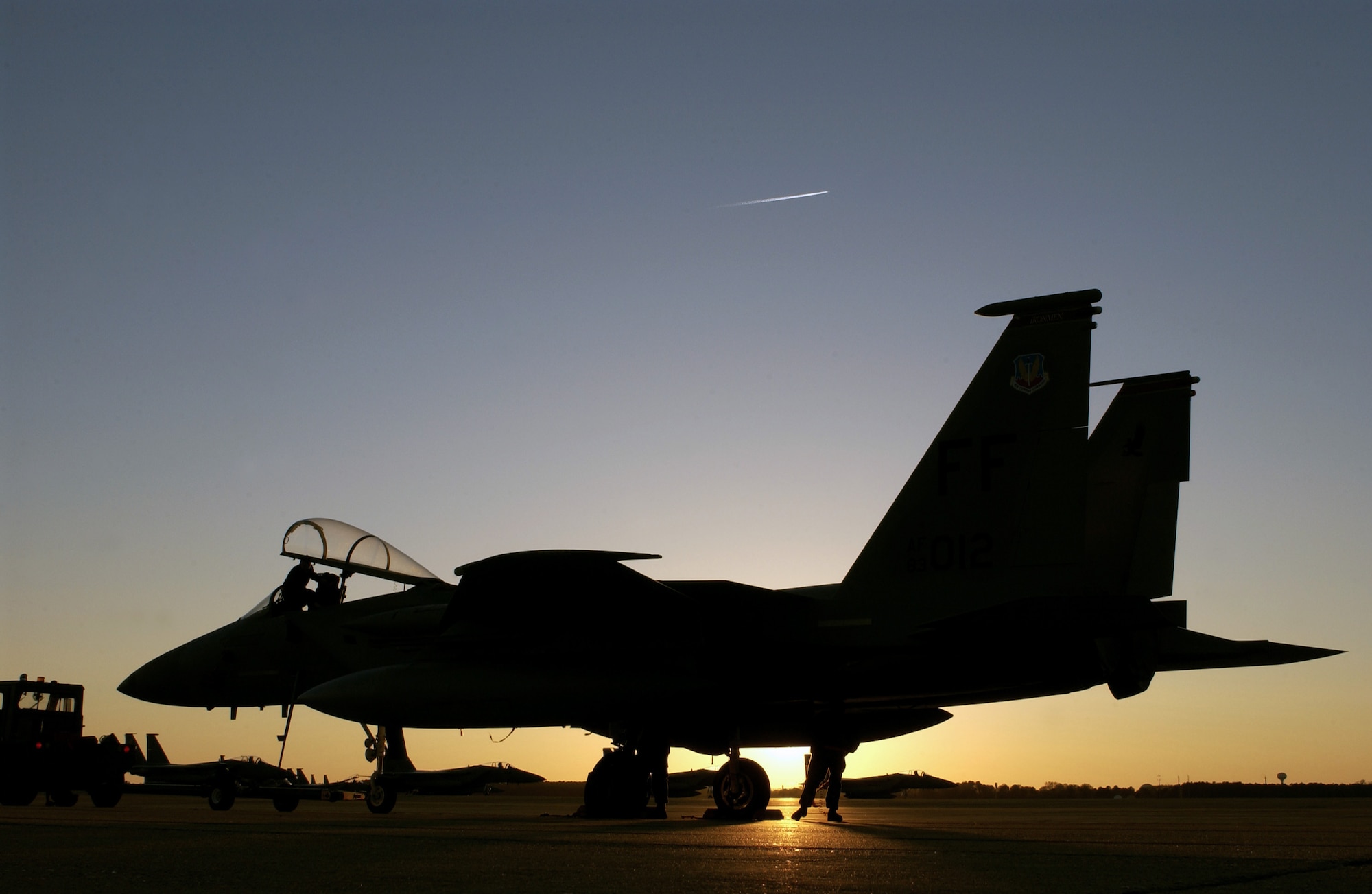 LANGLEY AIR FORCE BASE, Va. -- Crew chiefs with the 1st Aircraft Maintenance Squadron here tow an F-15 Eagle at the end of the day.  (U.S. Air Force photo by Tech. Sgt. Ben Bloker)