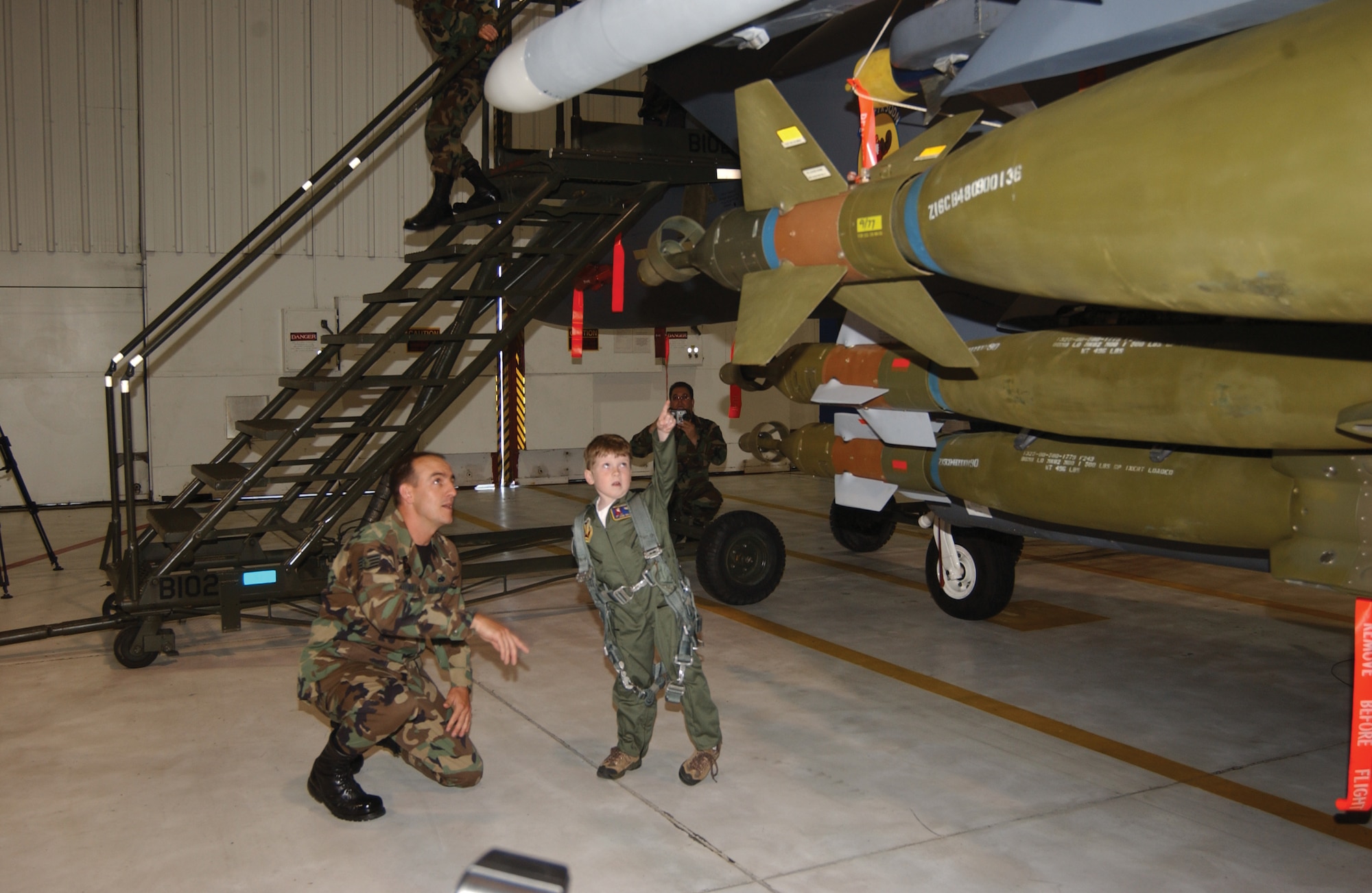 SEYMOUR JOHNSON AIR FORCE BASE, N.C. -- During a stop on his daylong tour April 15, Evan Moriarty looks at an F-15E Strike Eagle with Staff Sgt. Richard Pelletier of the 334th Aircraft Maintenance Unit here.  (U.S. Air Force photo by Airman 1st Class Micky Bazaldua)