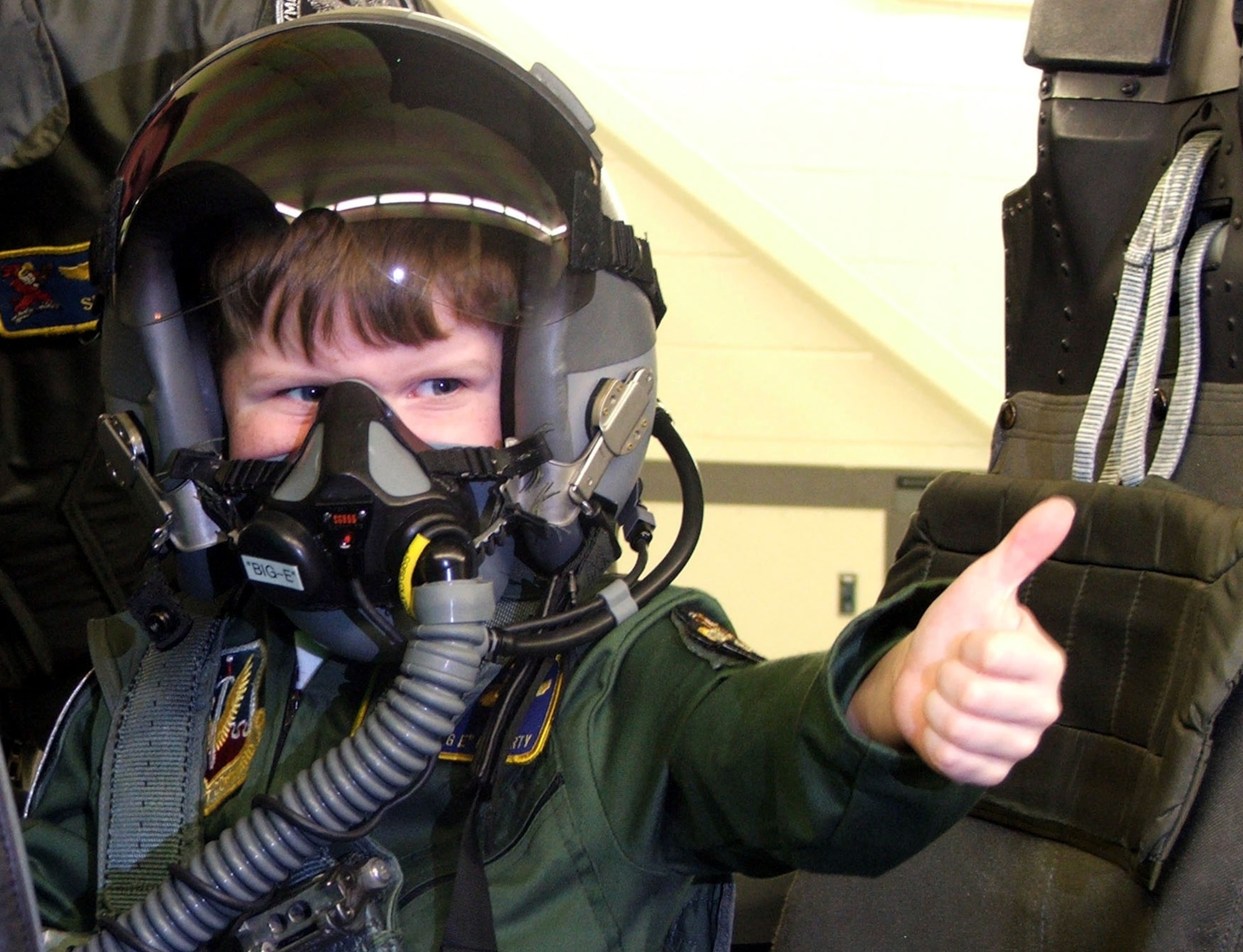 SEYMOUR JOHNSON AIR FORCE BASE, N.C. -- Five-year-old Evan Moriarty gives a thumbs up to family and friends during a ride in an F-15E Strike Eagle simulator April 15.  Riding in a jet has been a long time wish of the "Top Gun" fan, which was made possible by the Make-a-Wish Foundation and Airmen here.  (U.S. Air Force photo by Airman 1st Class Pablo Jara Meza)