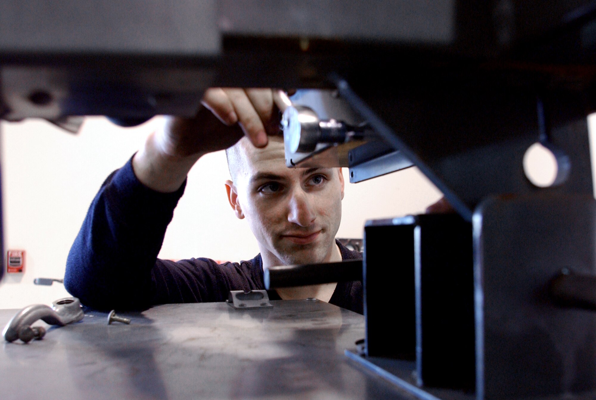 INCIRLIK AIR BASE, Turkey --  Senior Airman Brandon Urban repairs a broken flood light here recently. Airman Urban is an aerospace ground equipment technician with the 39th Maintenance Squadron. (U.S. Air Force photo by Airman 1st Class Bradley A. Lail) 