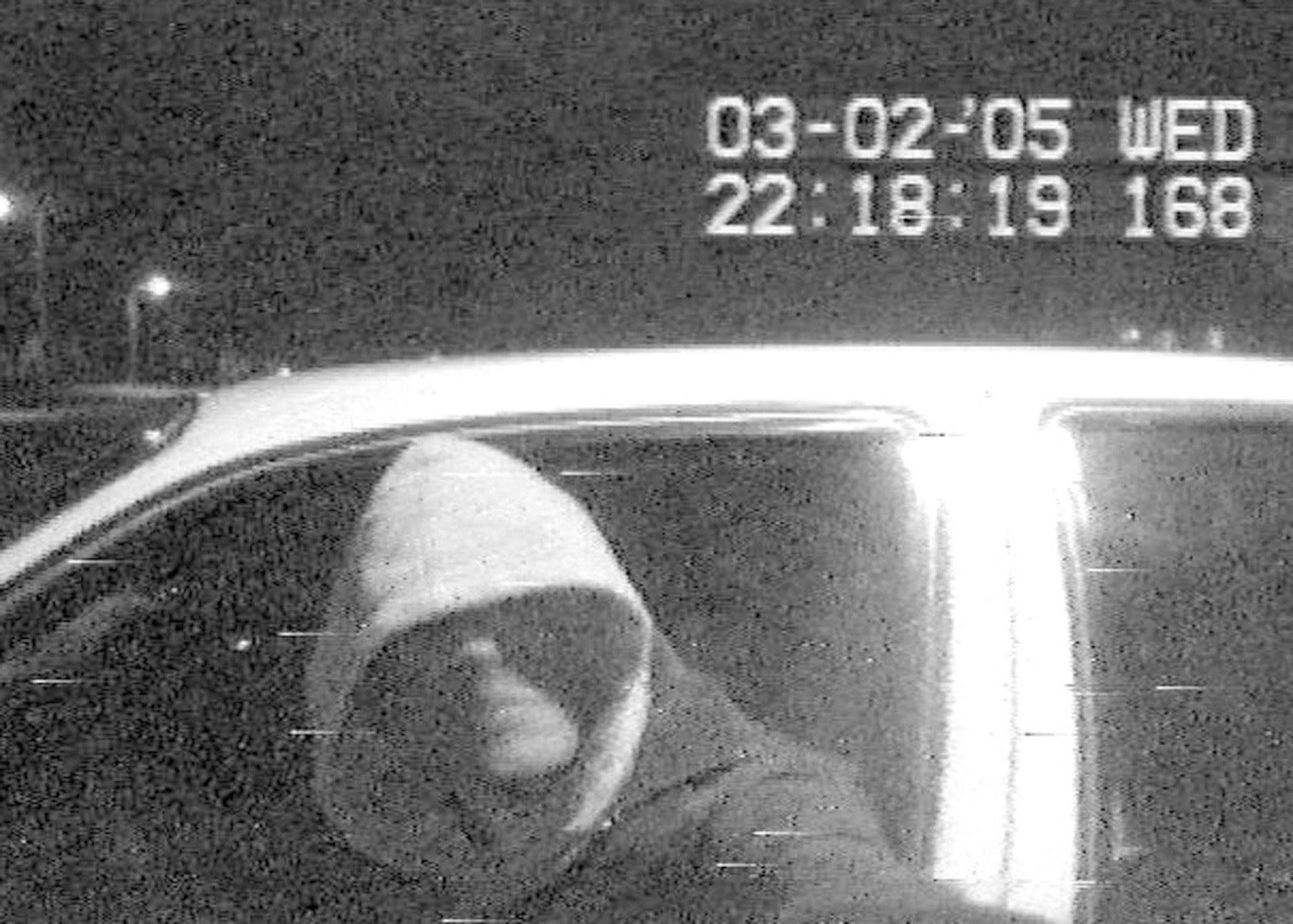 NEW MEXICO -- In the image frozen from a grainy video tape, a suspect in a double homicide case can be seen allegedly using the victim's credit card at an automated teller machine.  Airmen from the 27th Communications Squadron at nearby Cannon Air Force Base, captured the photo from the video and enhanced it to help local law enforcement agencies capture the suspect.  (Photo enhancement)