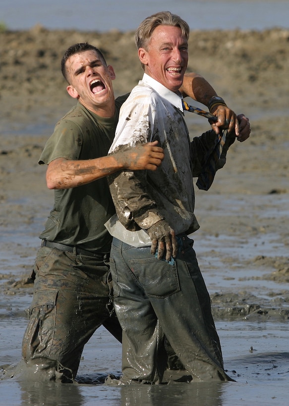 Cpl. John W. McJunkin (left) lets out a blast of motivation as he participates in the Swamp Romp with Honolulu Lifeguard, Lt. Dwight Perkins.