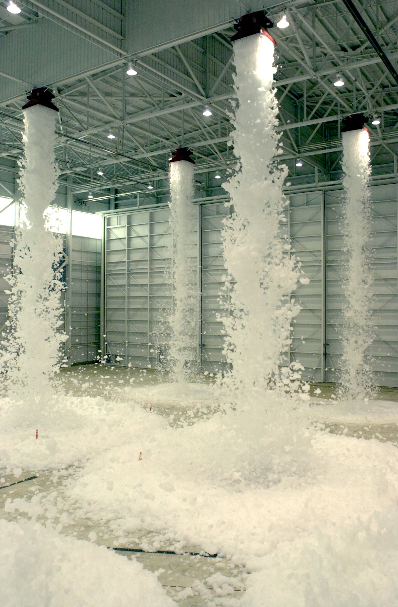 MARCH AIR RESERVE BASE, Calif. -- Generators pump foam from a 700-gallon tank onto the floor of a new hangar built for the 452nd Air Mobility Wing's C-17 Globemaster IIIs during the final fire sprinkler foam test April 20.  The wing is scheduled to begin receiving C-17s on Aug. 9.  (U.S. Air Force photo by Erickson J. Barnes)