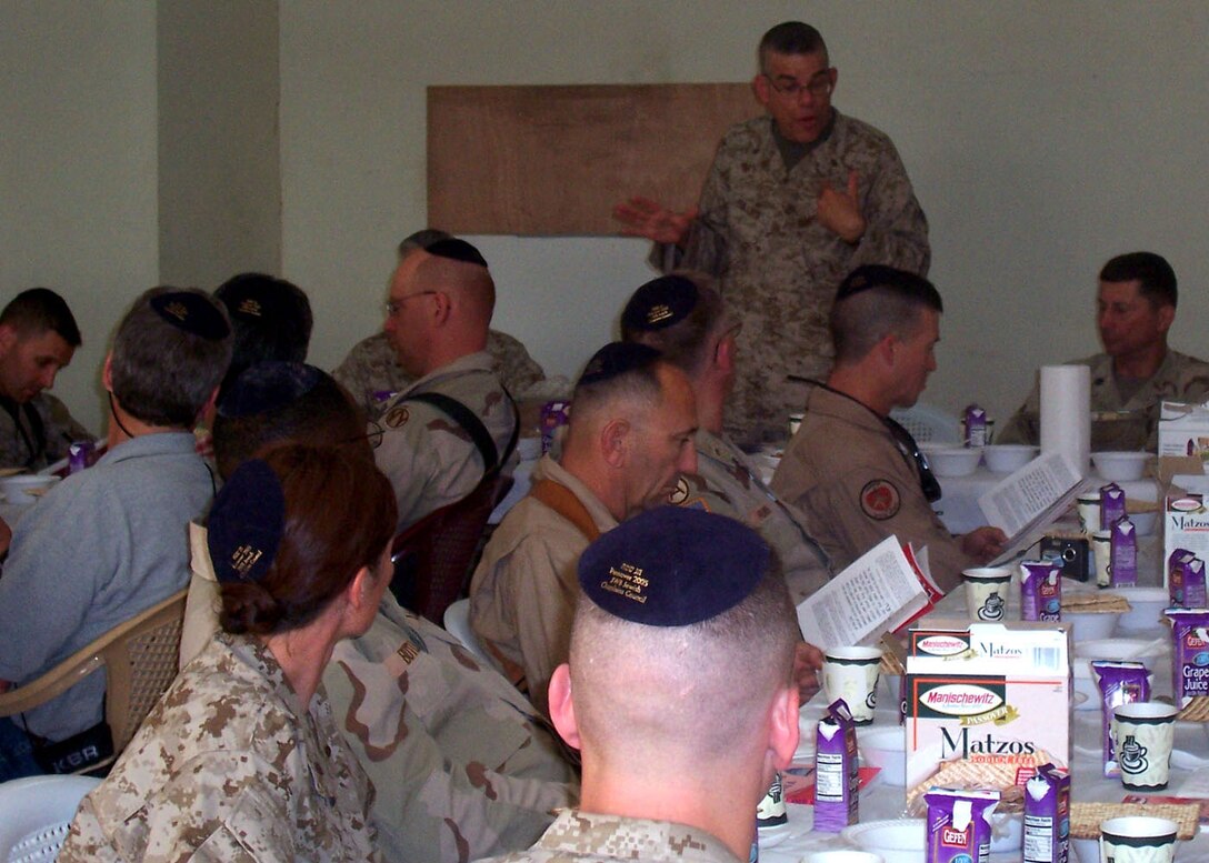 It was standing room only as Rabbi Seth Phillips, a lieutenant commander from the Naval Submarine Base in New London, Conn., leads more than 30 service members in the Seder meal here April 27.