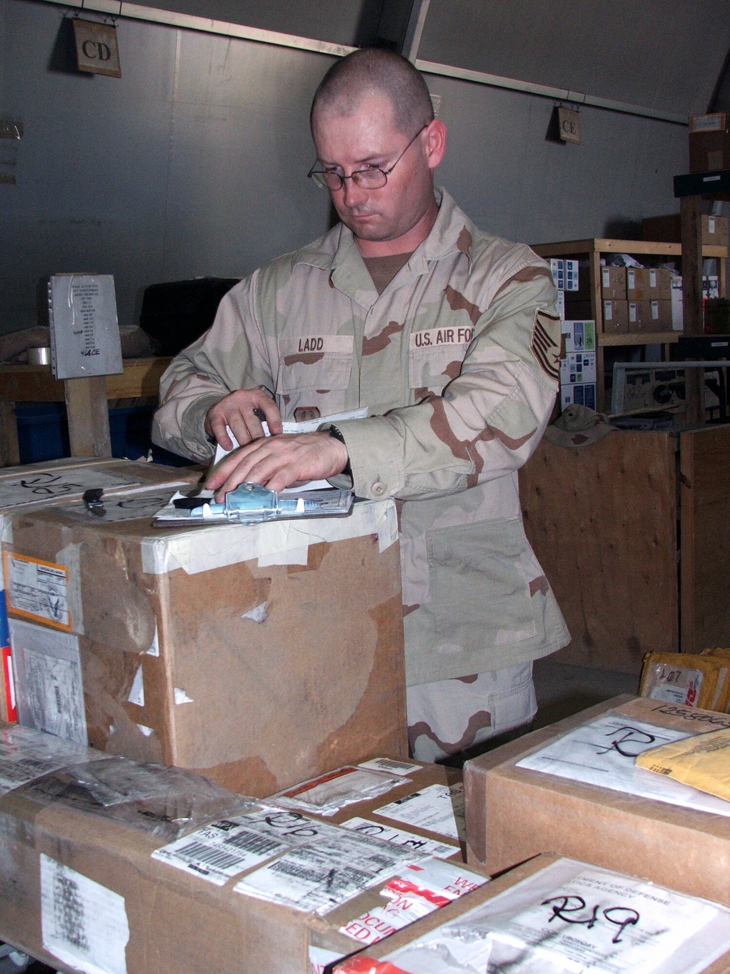 KARSHI-KHANABAD AIR BASE, Uzbekistan -- Master Sgt. Bill Ladd checks in cargo in the supply warehouse here April 26.  He is the superintendent for the 416th Expeditionary Mission Support Squadron's supply section and is deployed from Grand Forks Air Force Base, N.D.  (U.S. Air Force photo by Tech. Sgt. Scott T. Sturkol)