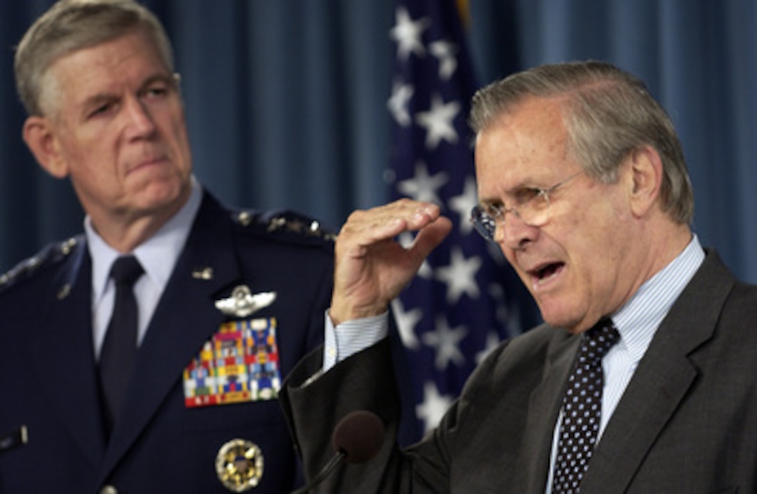 Secretary of Defense Donald H. Rumsfeld answers a reporter's question during a press briefing with Chairman of the Joint Chiefs of Staff Gen. Richard B. Myers, U.S. Air Force, in the Pentagon on April 26, 2005. Rumsfeld and Myers briefed reporters on the situation in Iraq. 