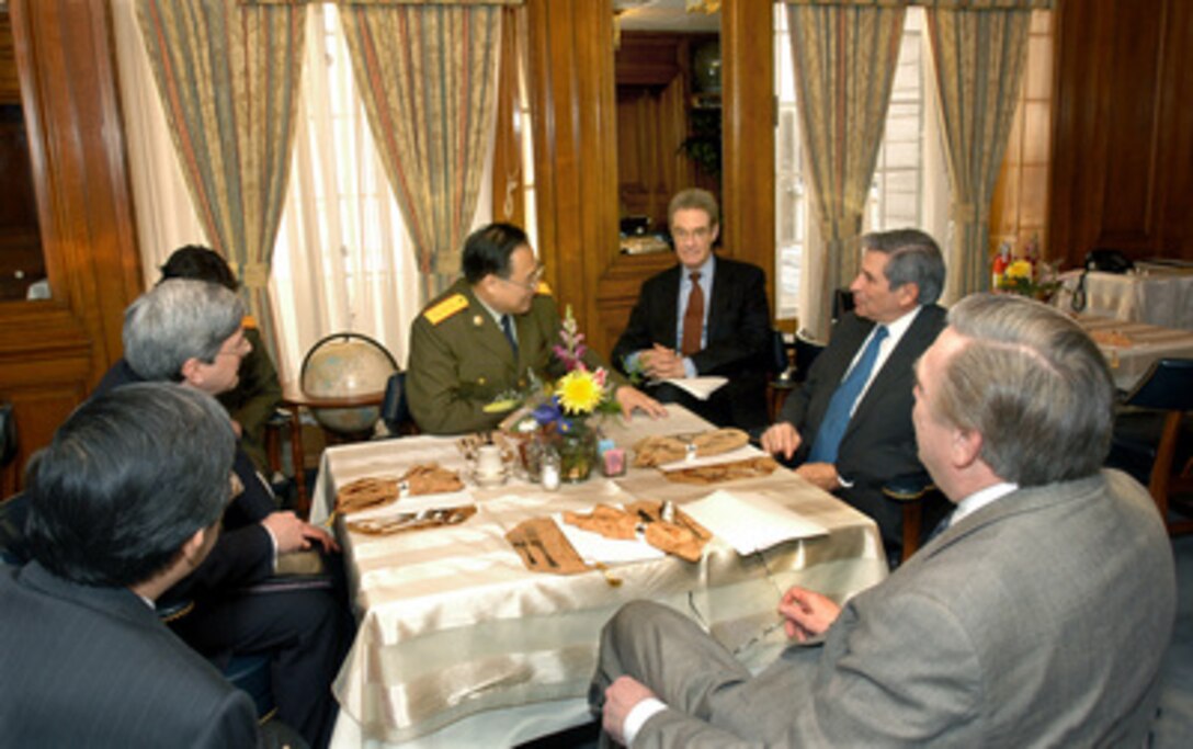 Deputy Secretary of Defense Paul Wolfowitz (2nd from right) holds talks with Chinese Deputy Chief of the General Staff Gen. Xiong Guangkai (center left) in the Pentagon on April 28, 2005. The meeting was part of the larger Defense Consultative Talks being chaired by Under Secretary of Defense for Policy Douglas Feith (2nd from left). Joining Wolfowitz and Feith on the U.S. side are Assistant Secretary of Defense for International Security Affairs Peter Rodman (center right) and Deputy Assistant Secretary of Defense for Asian & Pacific Affairs Richard Lawless (right foreground). 