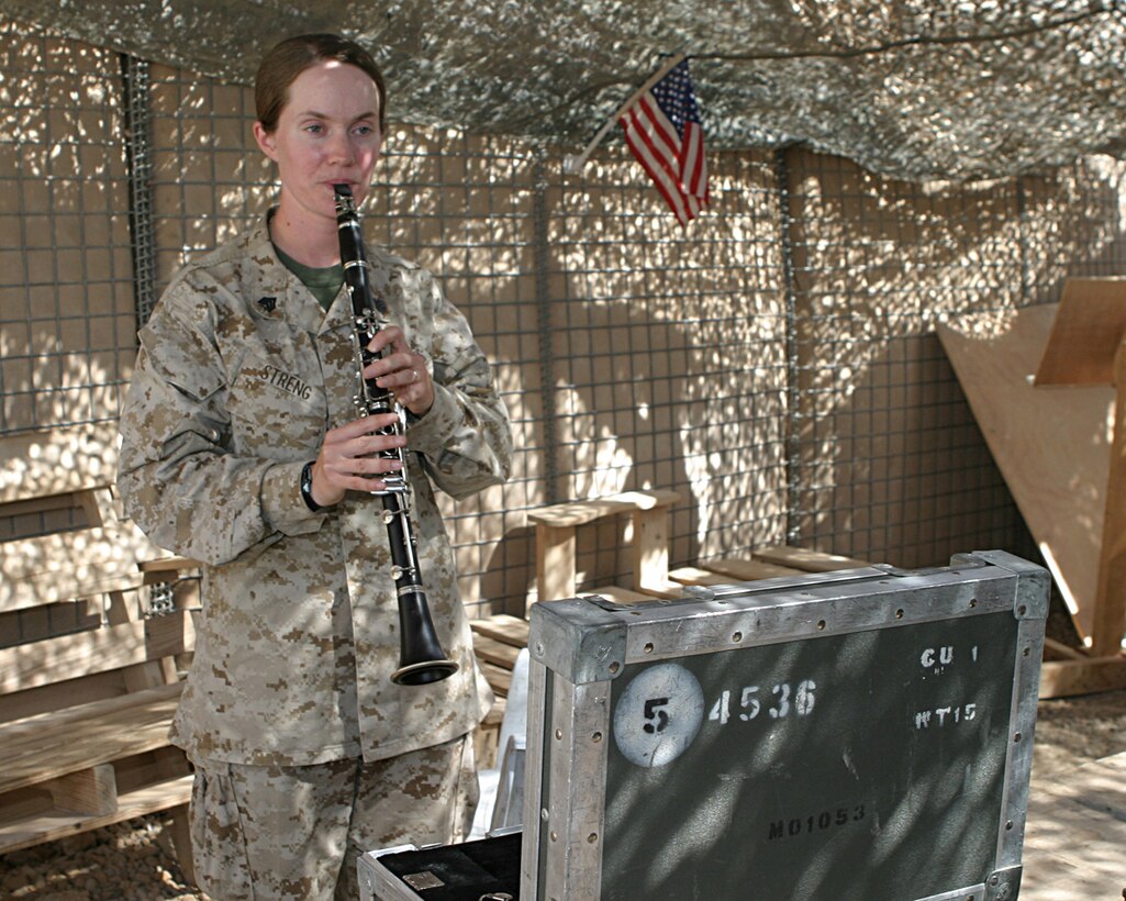 AL ASAD, Iraq--April 29, 2005, Sgt. Kristine Streng, from Powhatan, Va., practices playing the clarinet in order to keep her skills as a musician sharp.  Sgt. Streng is the sergeant of the guard for the 2nd Marine Aircraft Wing Band. While the 2nd MAW band is forward deployed here their primary mission is to provide security.