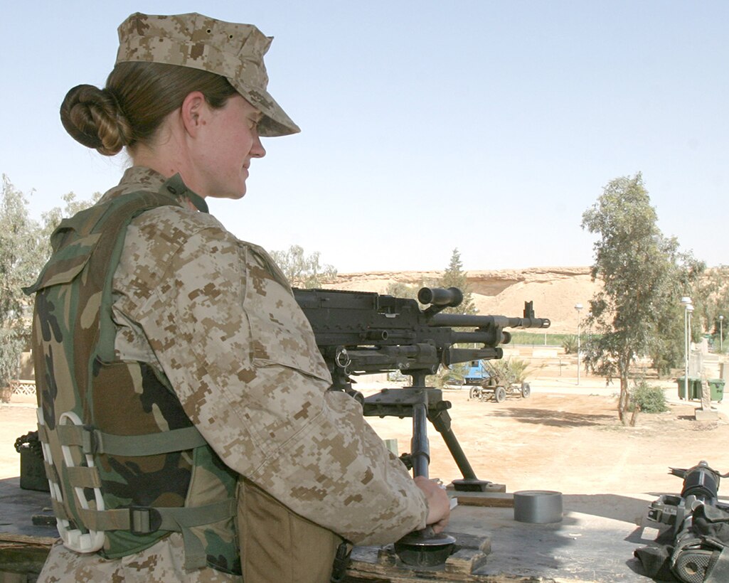 April 29, 2005, Sergeant Kristine Streng, a musician with the 2d Marine Aircraft Wing Band, mans 240 Golf while on post in a watchtower over a secure compound at Al Asad, Iraq. (USMC photo by Cpl. Alicia M. Garcia)