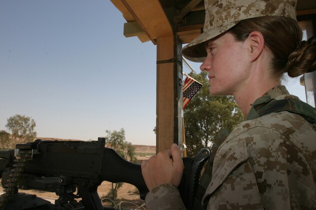 April 29, 2005, Sergeant Kristine Streng, a musician with the 2d Marine Aircraft Wing Band, mans a watch tower over a secure compound in Al Asad, Iraq. (USMC photo by Cpl. Alicia M. Garcia)