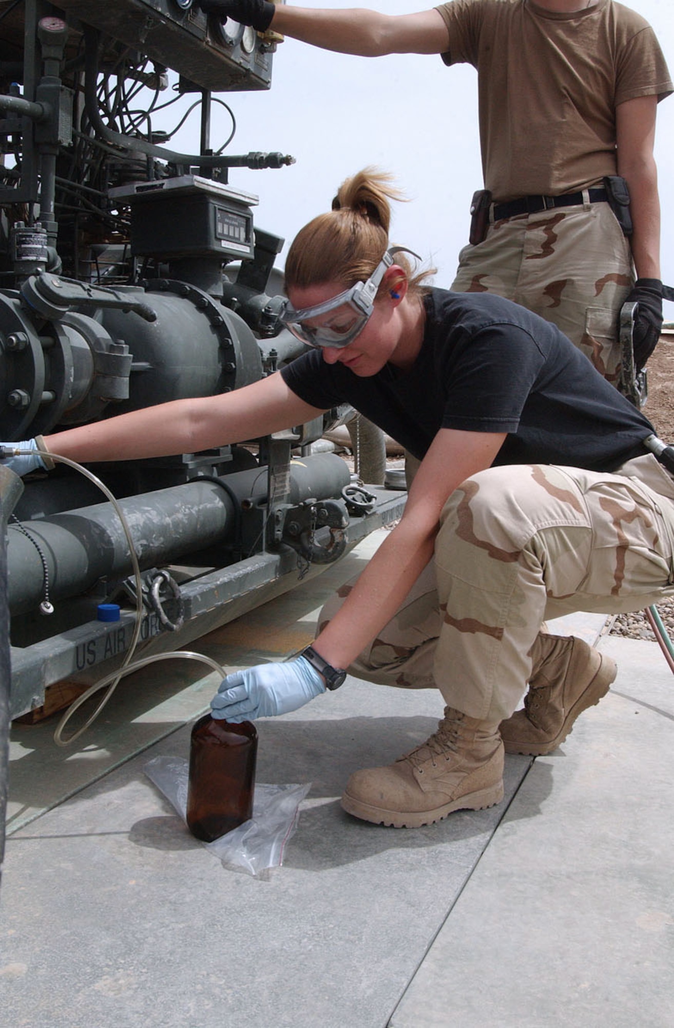 BALAD AIR BASE, Iraq -- Senior Airman Amy Finkelbeiner performs a quality analysis on a fuel stand here.  Airmen of the 332nd Expeditionary Logistics Readiness Squadron's fuels management flight monitor and sample fuel to ensure it is suitable for aircraft use.  Airman Finkelbeiner is a fuels laboratory technician and is deployed from Davis-Monthan Air Force Base, Ariz.  (U.S. Air Force photo by Senior Airman Colleen Wronek)