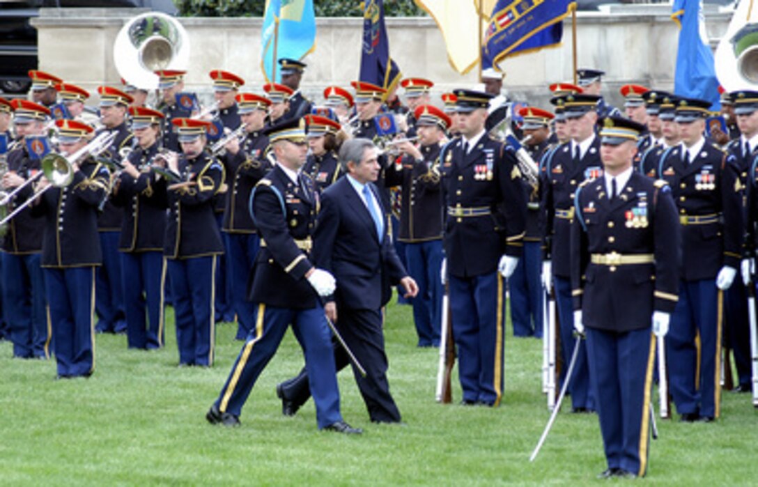 Deputy Secretary of Defense Paul Wolfowitz is escorted by Commander of Troops Col. Chuck Taylor as inspects the honor guard during his farewell ceremony on the Pentagon River Parade Field on April 29, 2005. Secretary of Defense Donald H. Rumsfeld presented Wolfowitz with the Department of Defense Medal for Distinguished Public Service. Wolfowitz is leaving the Defense Department to become president of the World Bank. 