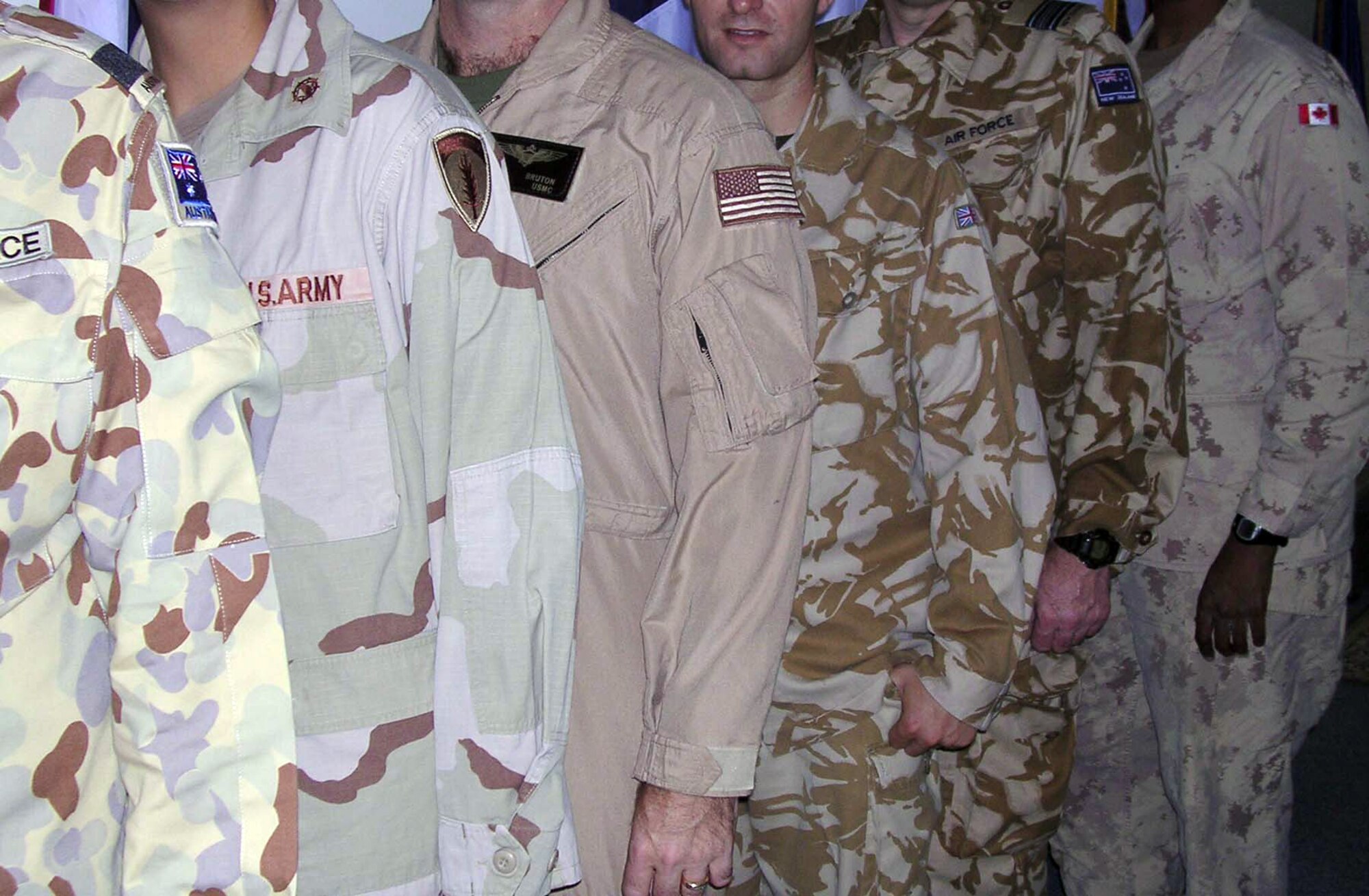 SOUTHWEST ASIA -- The Central Air Forces Combined Air Operations Center is staffed by active-duty, Guard and Reserve forces from all the U.S. services as well as coalition partners.  Some services represented at the center include (from left) the Royal Australian air force, U.S. Army, U.S. Marine Corps, Royal air force, New Zealand air force and Canadian air force.  Servicemembers work side by side planning and executing operations for operations Iraqi Freedom and Enduring Freedom as well as Joint Task Force-Horn of Africa.  (U.S. Air Force photo by Staff Sgt. Chyenne A. Griffin)