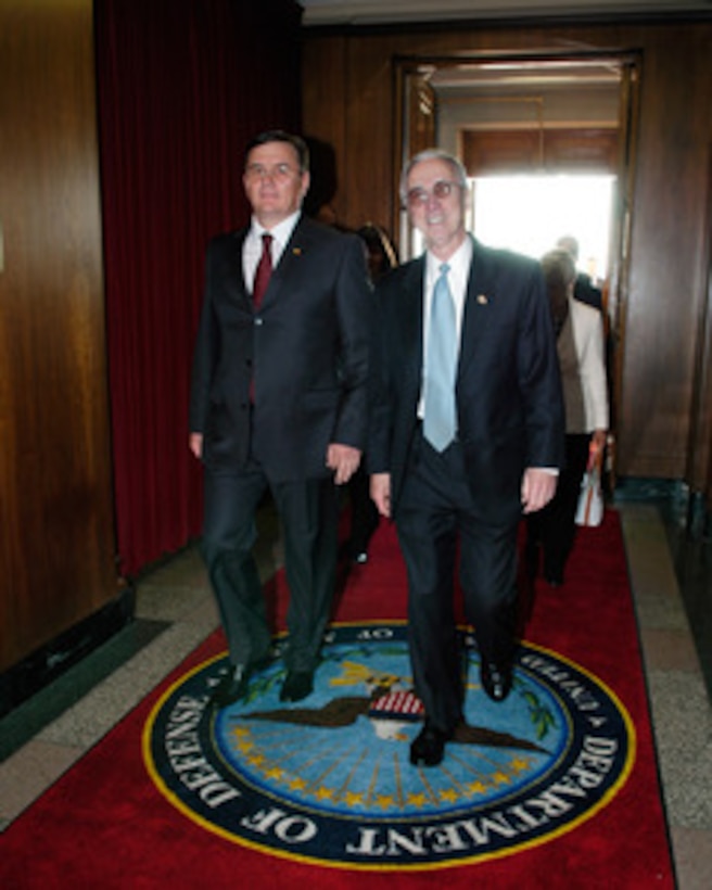 Acting Deputy Secretary of Defense Gordon England (right) escorts Moldovan Minister of Defense Valeriu Plesca (left) into the Pentagon on August 2, 2005. England and Plesca will meet to discuss defense issues of mutual interest. 