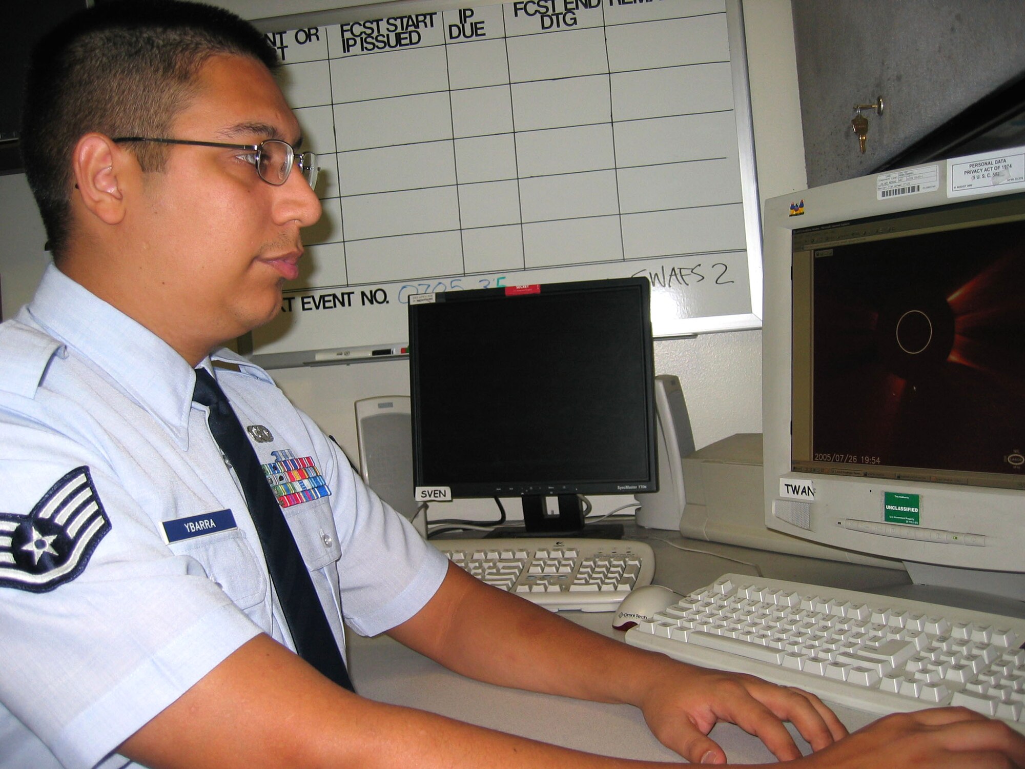 OFFUT AIR FORCE BASE, Neb. -- Staff Sgt. Guillermo Ybarra III, uses a solar observation program to monitor solar flare activity. Space weather Airmen closely observe a variety of space weather effects such as solar winds, geomagnetic storms and solar flares ensuring that satellite communications are not disrupted. He is assigned to the Air Force Weather Agency. (U.S. Air Force photo by Tech. Sgt. Joy Josephson)