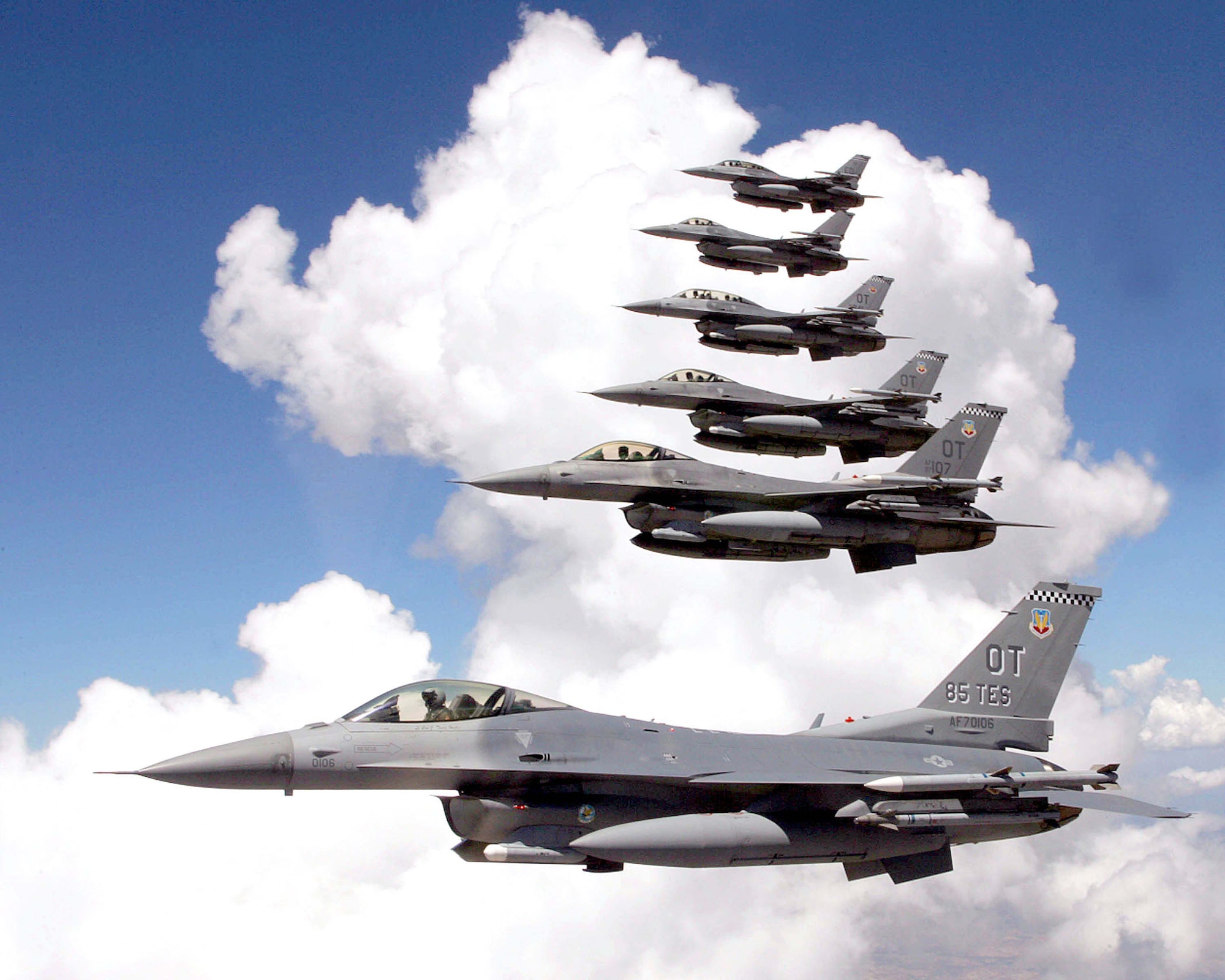 OVER CALIFORNIA -- Six F-16 Fighting Falcons fly in formation during combined developmental and operational testing of the M4.2-plus core avionics suite upgrade to the aircraft.  The formation consists of operational test aircraft from Eglin Air Force Base, Fla., and developmental test aircraft from Edwards AFB, Calif.  (U.S. Air Force photo by Tom Reynolds)