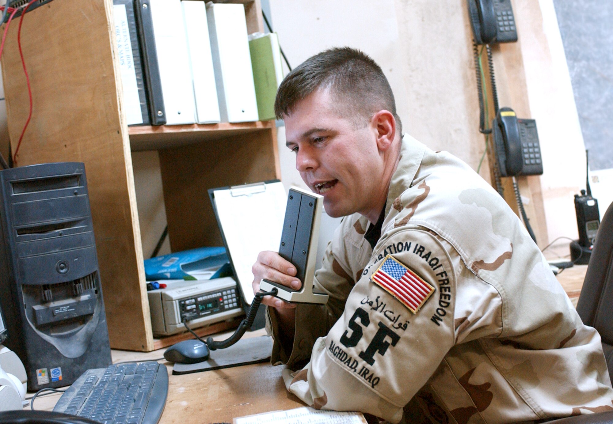 BAGHDAD, Iraq -- Staff Sgt. Alan Clontz works from the Battle Defense Operations Center as command and control during prisoner movement.  Sergeant Clontz serves as the critical communication link between Soldiers and Airmen.  He is assigned to the 447th Expeditionary Security Forces Squadron and is deployed from Cannon Air Force Base, N.M.  (U.S. Air Force photo by Tech. Sgt. Brian Davidson)