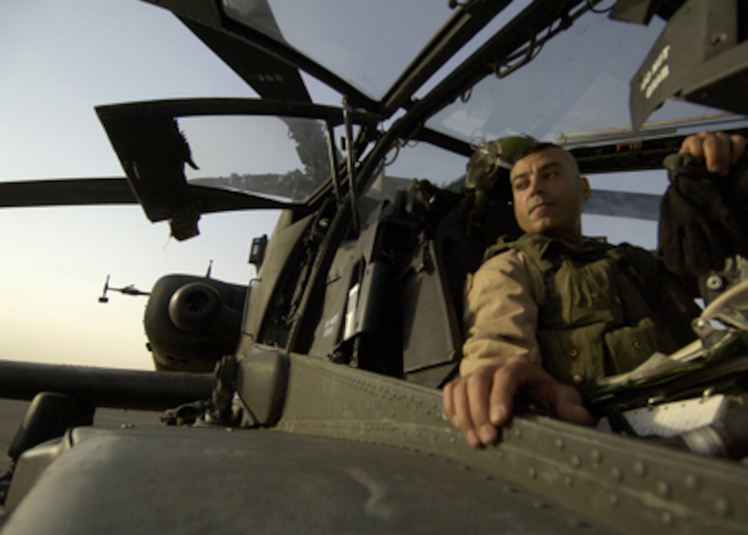 U.S. Army Chief Warrant Officer Mike Corsaro mans the gunner's station on an AH-64D Apache Longbow at Forward Operating Base Sykes, Iraq, on Aug. 5, 2005. Corsaro is assigned to the 3rd Armored Cavalry Regiment, Longknife Squadron, Renegade Troop, which is currently deployed in Iraq's Ninewa province. 