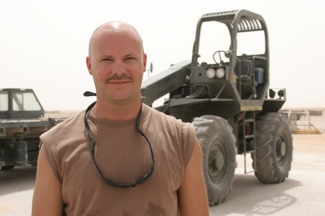 AL ASAD, Iraq ? Petty Officer 2nd Class Andy Roberts, an administrator and load planner with Mobile Air Cargo Handling Team 3 and Willard, Mo., native, is serving for the first time in Iraq in his 17-year Navy reserves? career.