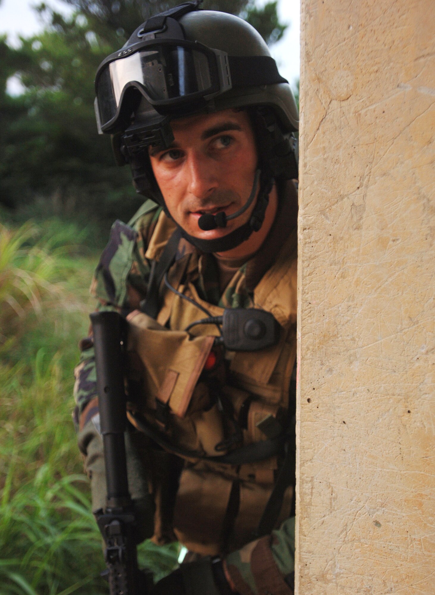 KADENA AIR BASE, Japan -- Senior Airman Jonathan Courtright keeps an eye on "enemy" forces while conducting a "rescue mission" during Joint Air and Sea Exercise 2005 here. Airman Courtright is a pararescueman with the 31st Rescue Squadron. (U.S. Air Force photo by Master Sgt. Val Gempis) 
